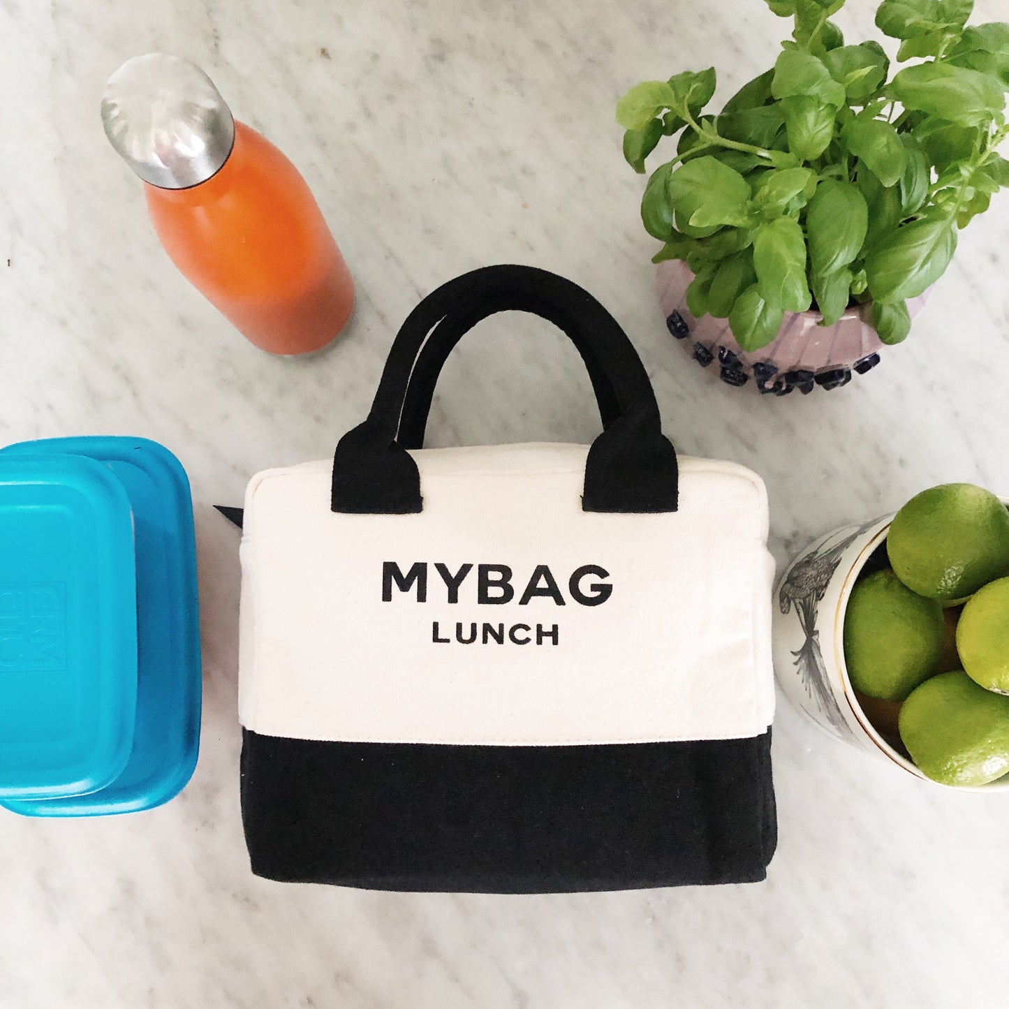 
                                      
                                        White and black lunch box with "My Bag Lunch" printed on the front. 
                                      
                                    