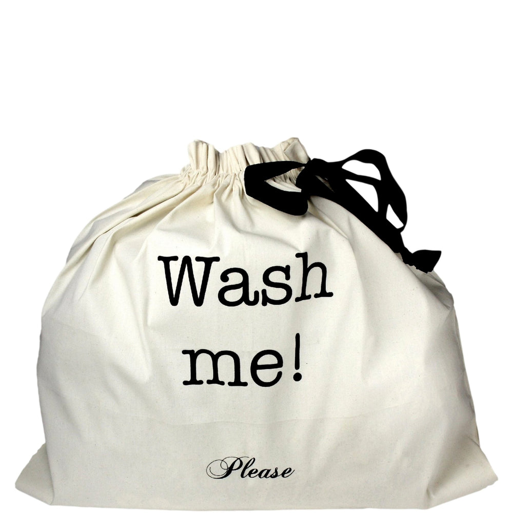 Large laundry bag with "wash me" printed on the front. 