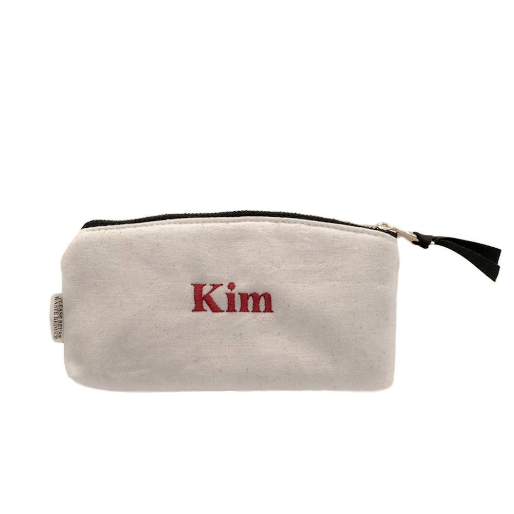 
                                      
                                        Padded sunglasses case with "kim" monogrammed on the back.
                                      
                                    
